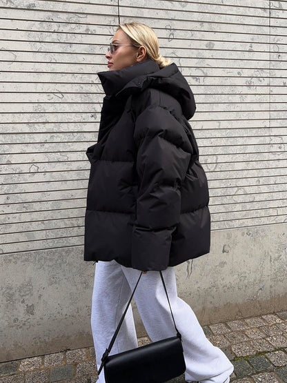 Women's Quilted Hooded Puffer Jacket with an Oversized Fit and Zip Closure